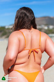 Adjustable, triangle style bikini top in bright poppy orange by Rooted Swim