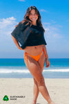 Rooted Swim skimpy bright poppy orange bikini bottoms, best for tanning