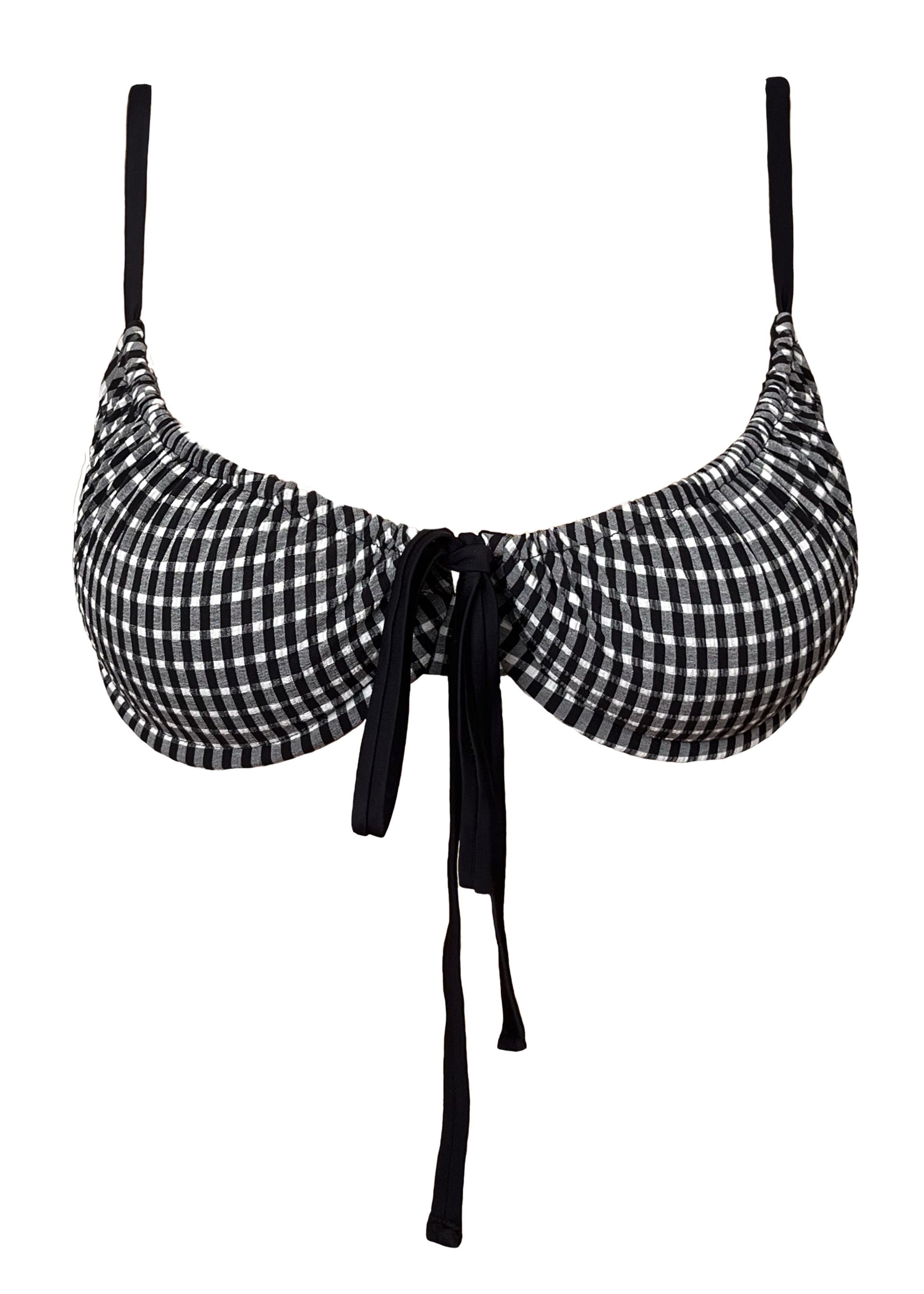 Black and white checkered bikini top with straps on a white background