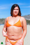 Adjustable, triangle style bikini top in bright poppy orange by Rooted Swim