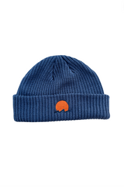 Classic cuffed knit fisherman beanie featuring embroidered Rooted Swim sunset logo in a blue gray color. high quality knit beanie